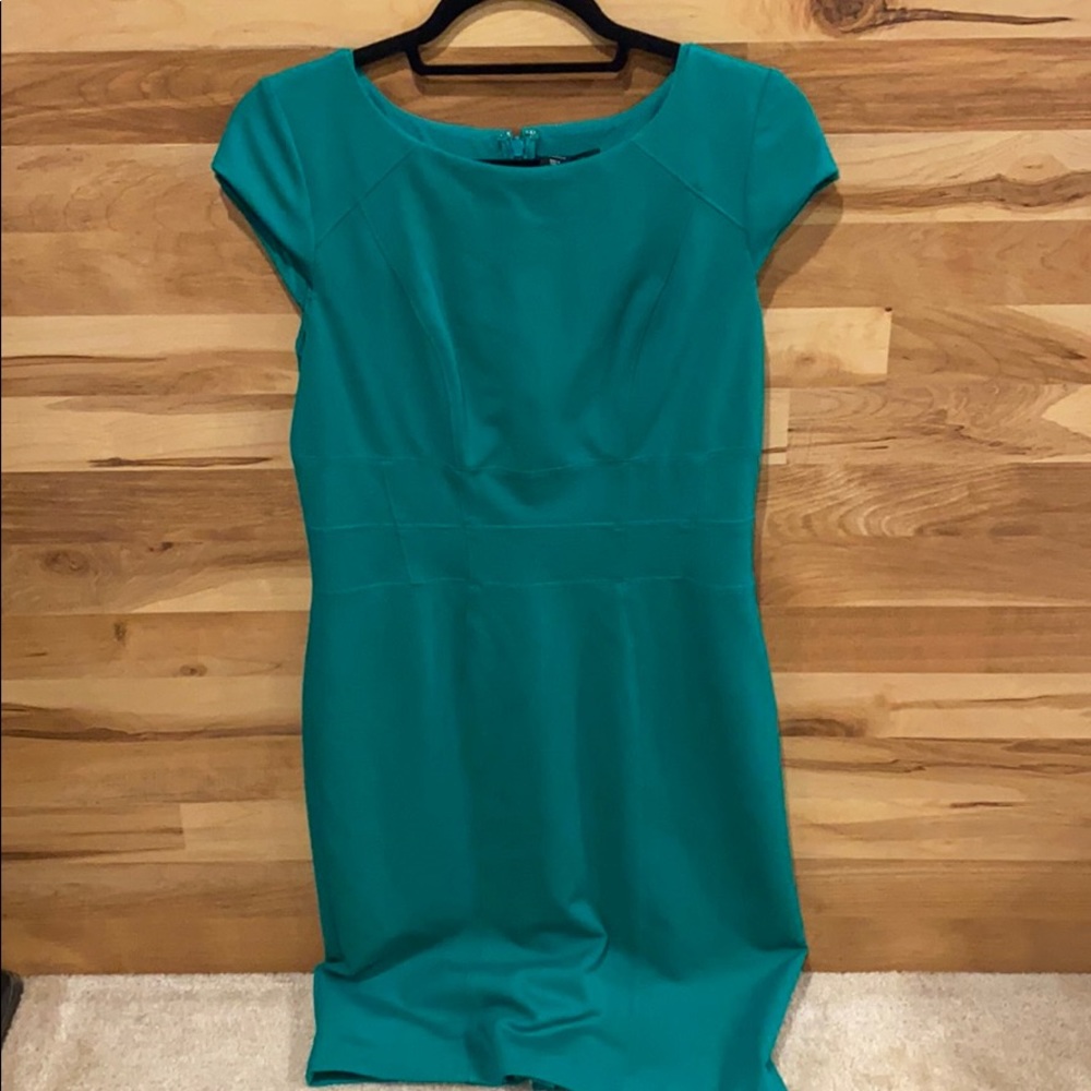 Beautifully lined Emerald green dress